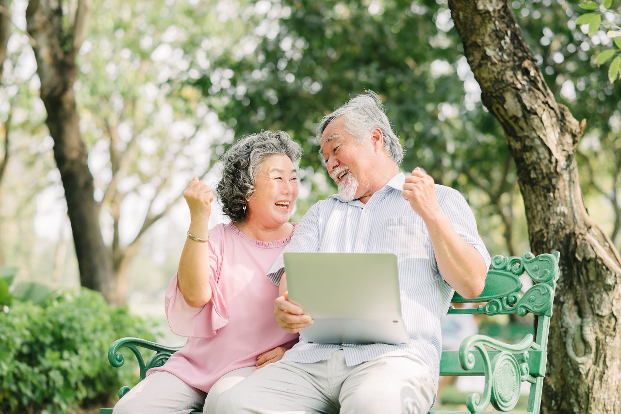 A senior couple researching possible retirement options